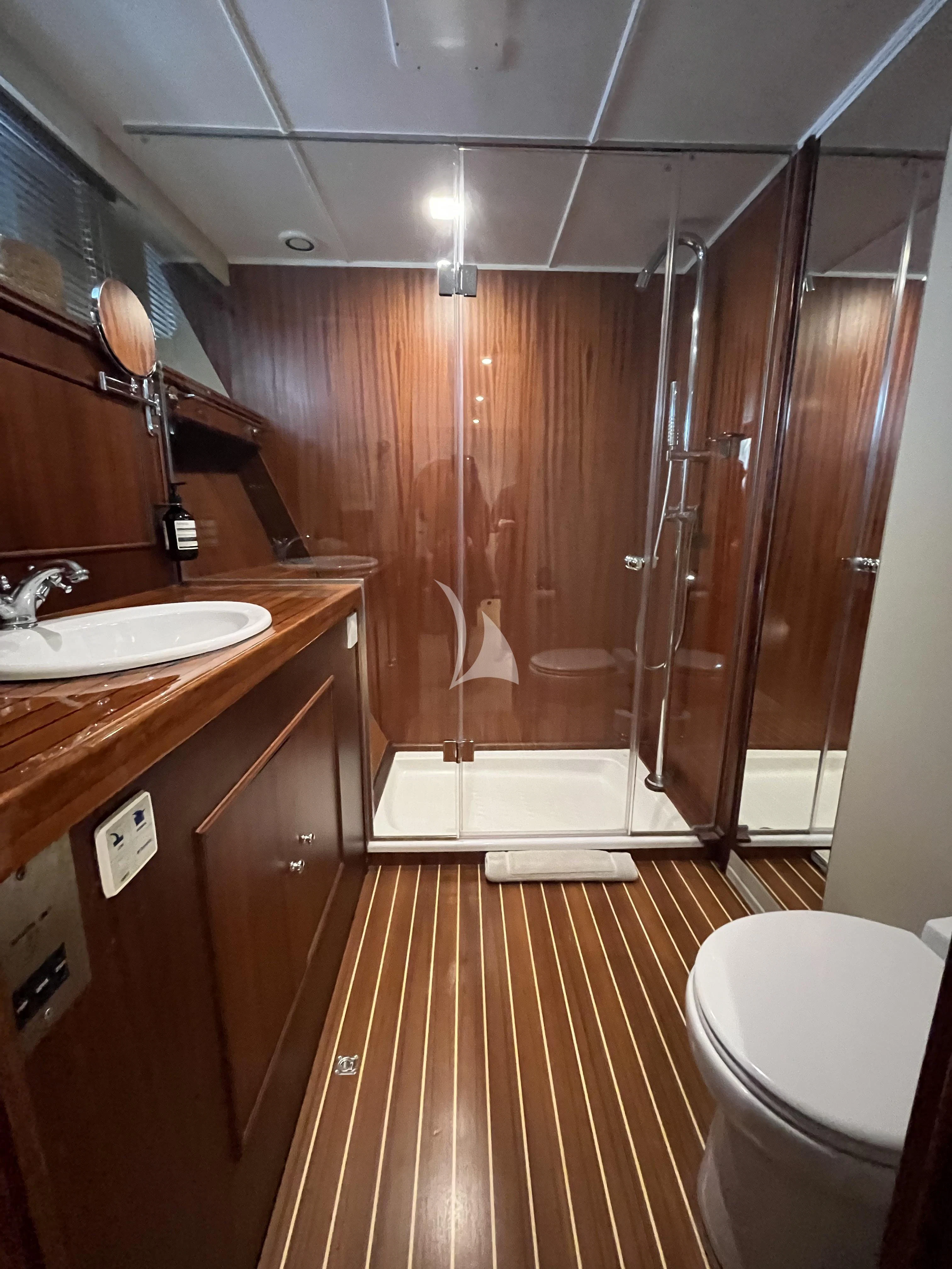 a bathroom with a shower and sink aboard STALCA Yacht for Sale