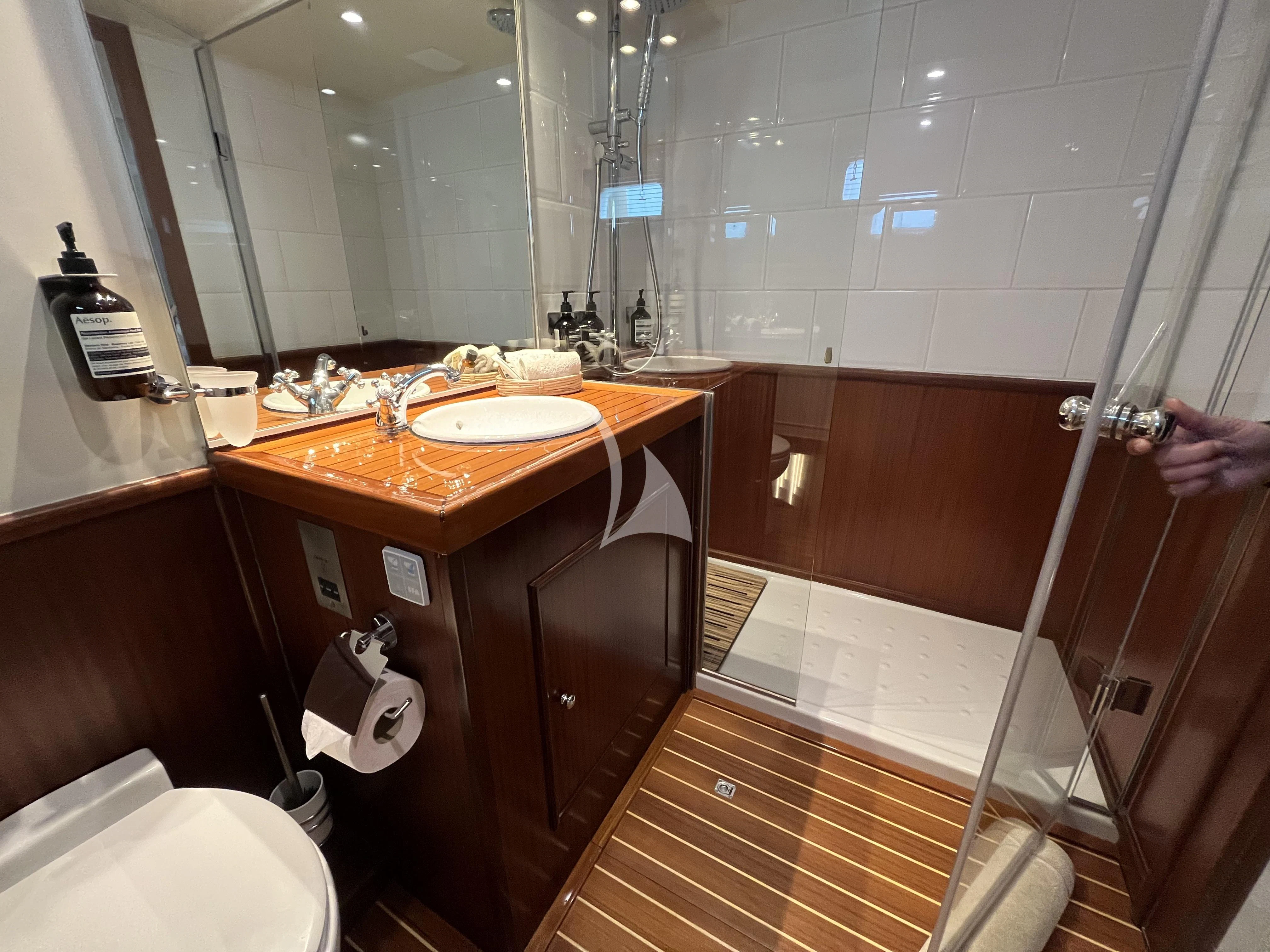 a bathroom with a sink and a shower aboard STALCA Yacht for Sale