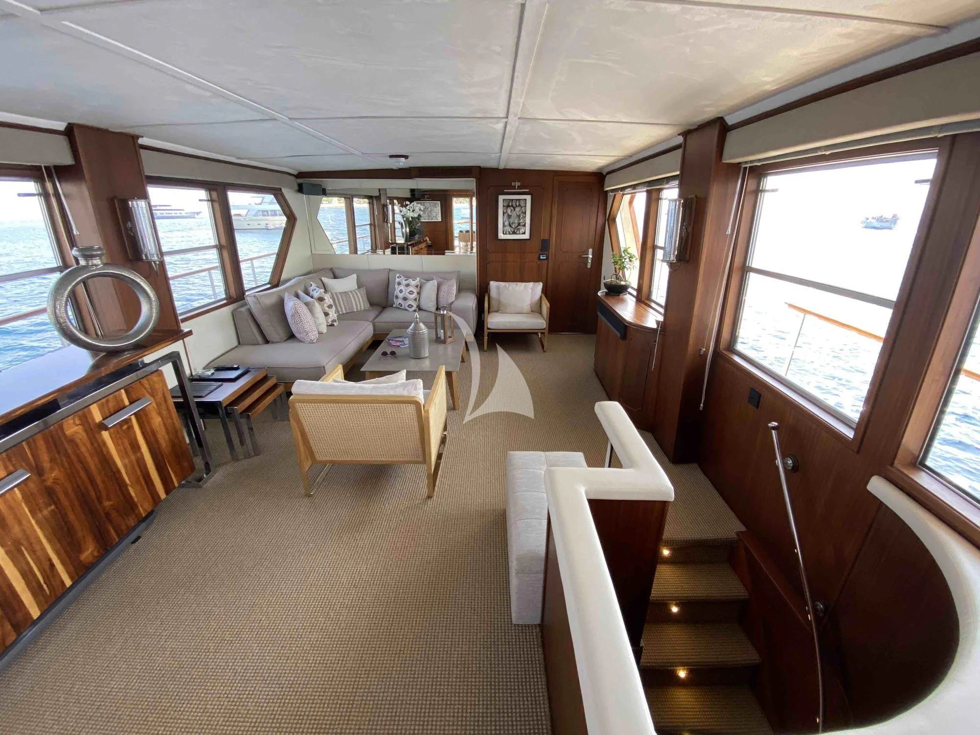 a large room with a couch and a table aboard STALCA Yacht for Sale