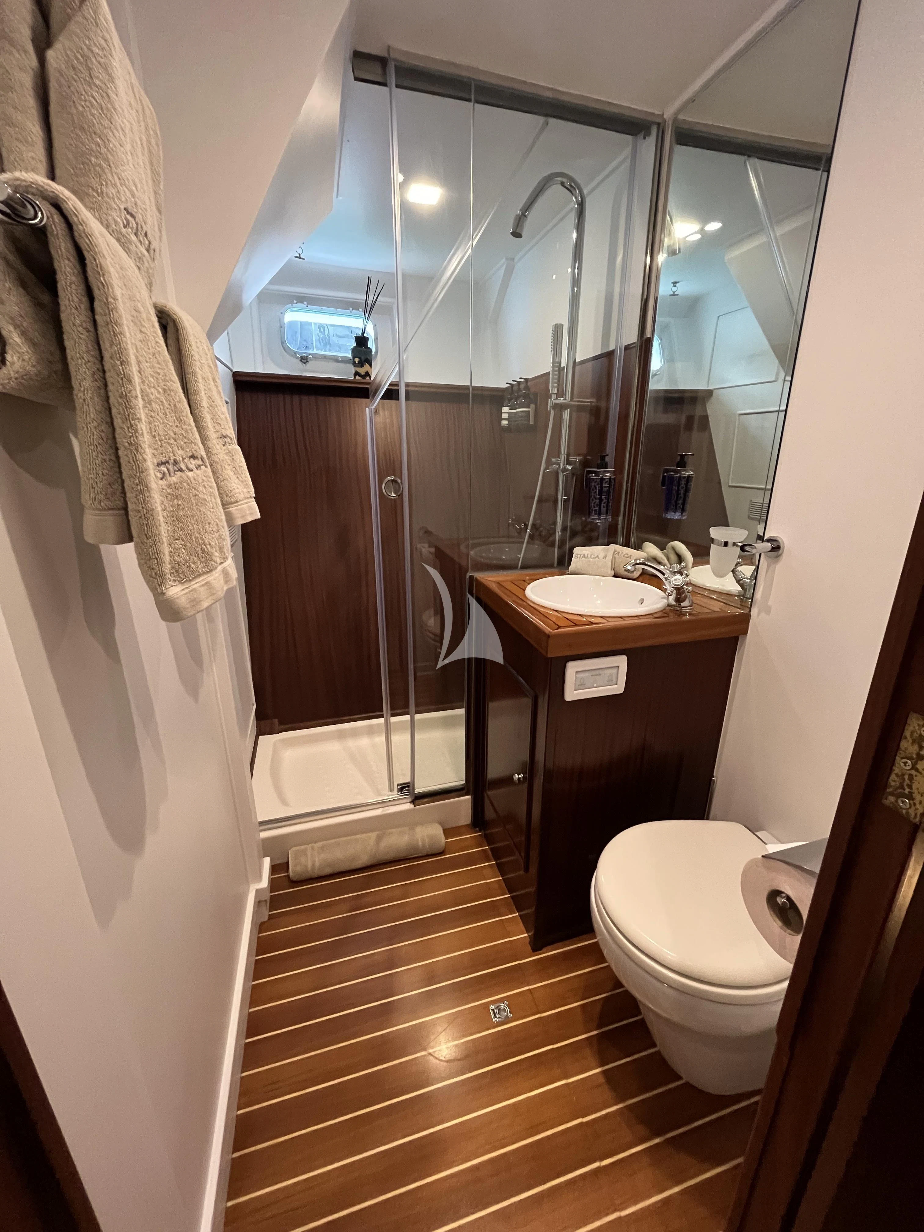 a bathroom with a sink toilet and a shower aboard STALCA Yacht for Sale