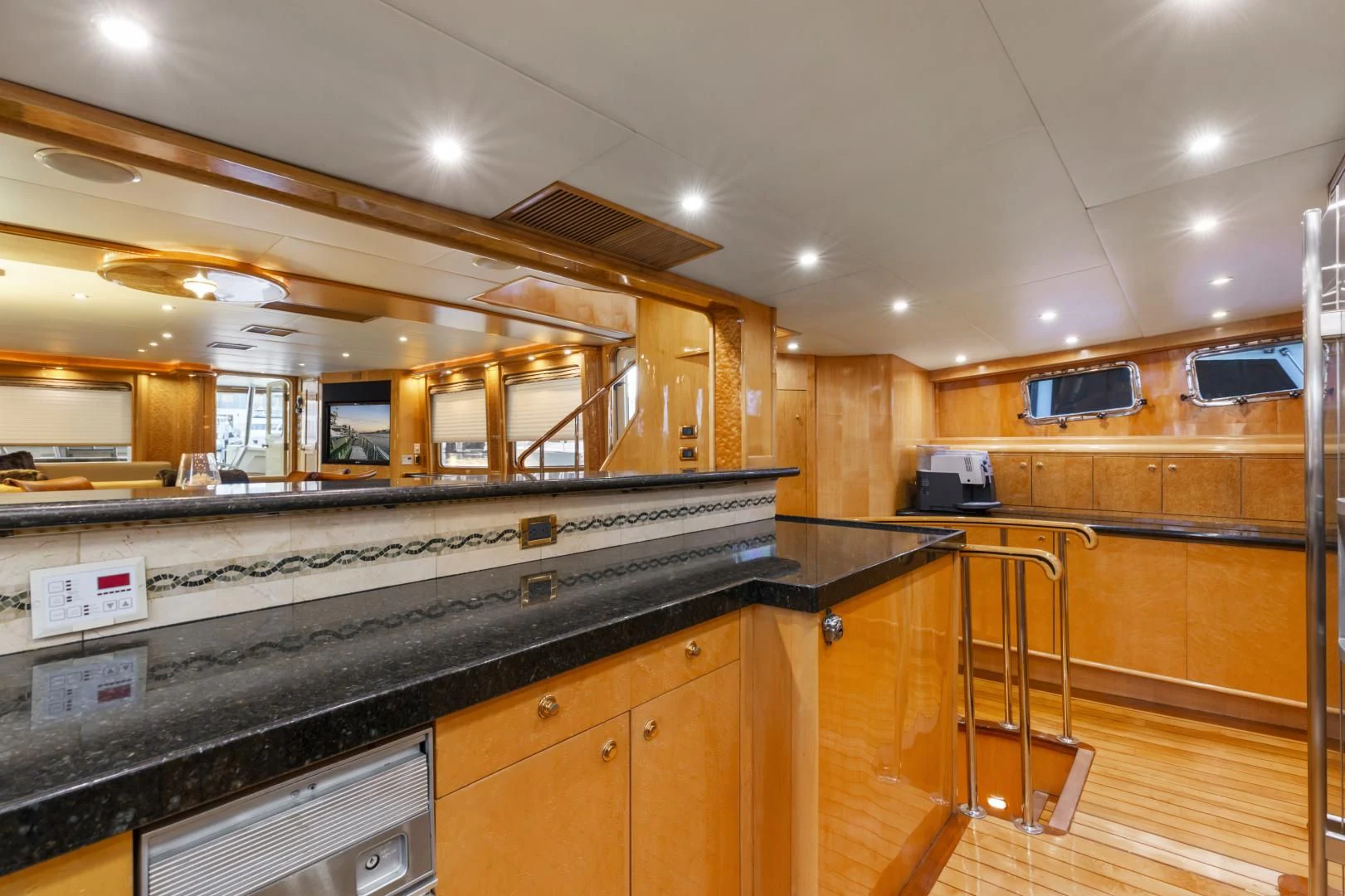 a kitchen with a large glass window aboard HOLIDAY Yacht for Sale