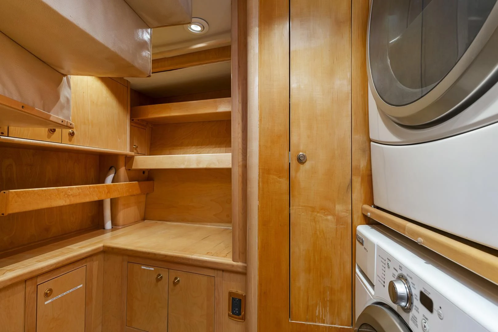 a kitchen with wooden cabinets aboard HOLIDAY Yacht for Sale