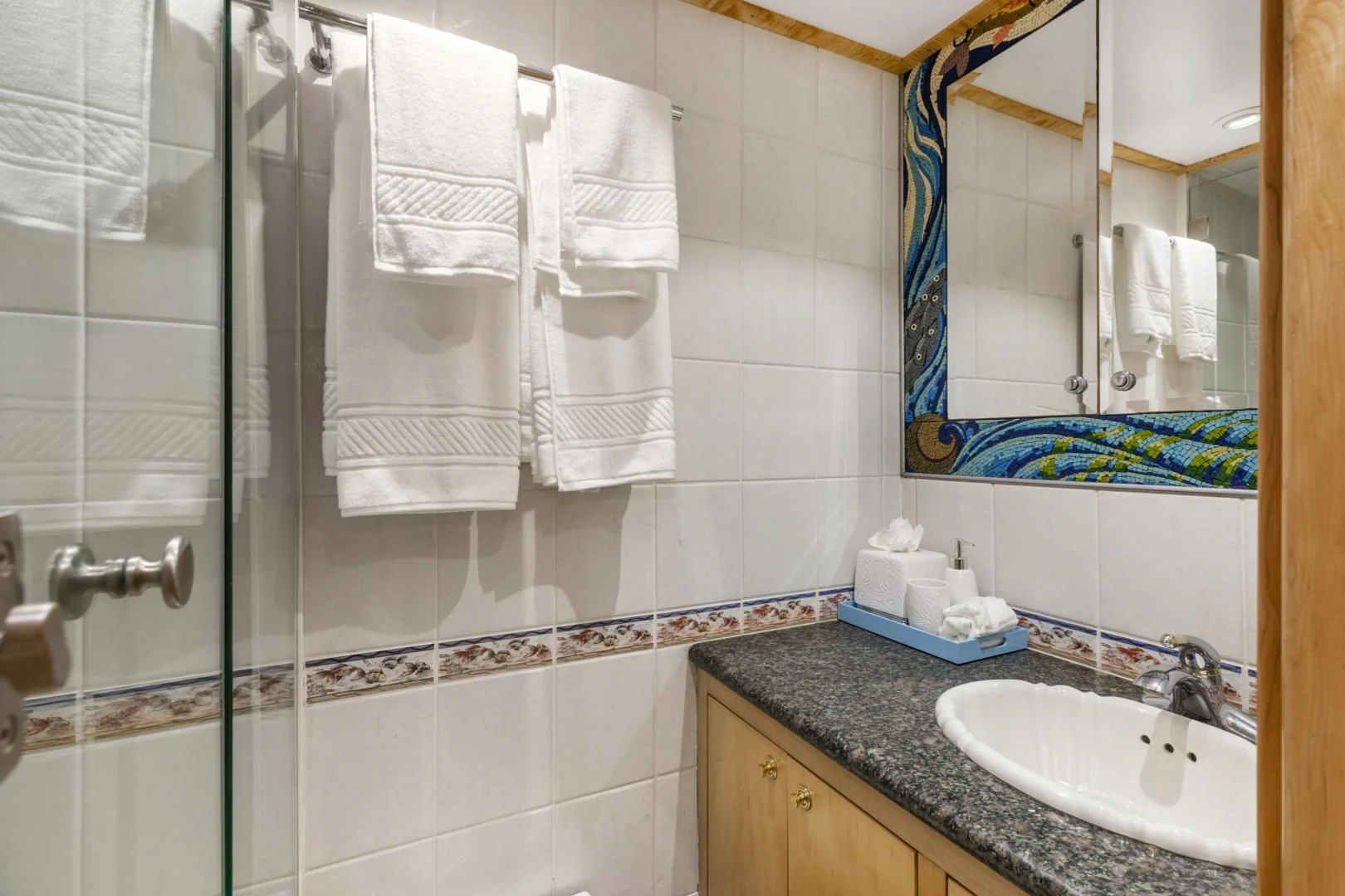 a bathroom with towels on the wall aboard HOLIDAY Yacht for Sale