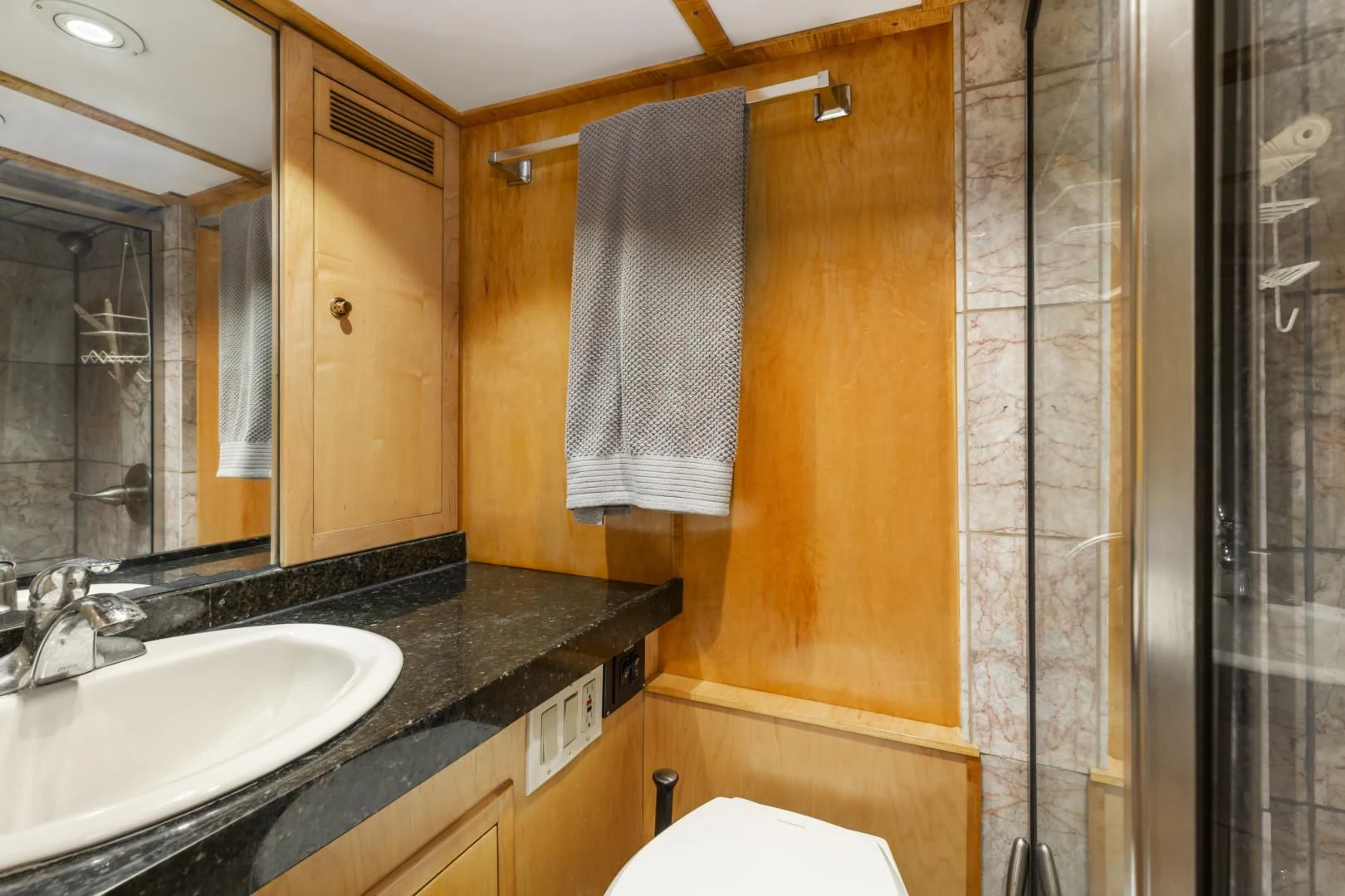 a bathroom with a sink and a mirror aboard HOLIDAY Yacht for Sale