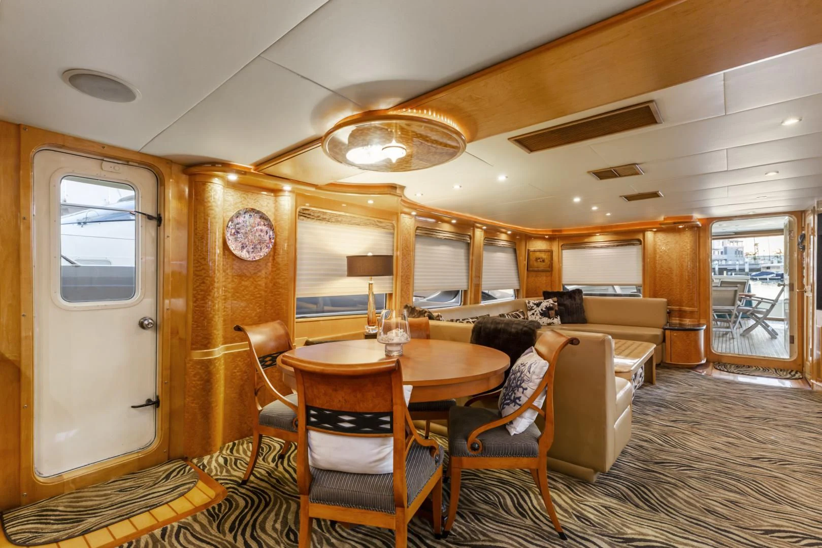 a person sitting at a table in a cabin aboard HOLIDAY Yacht for Sale