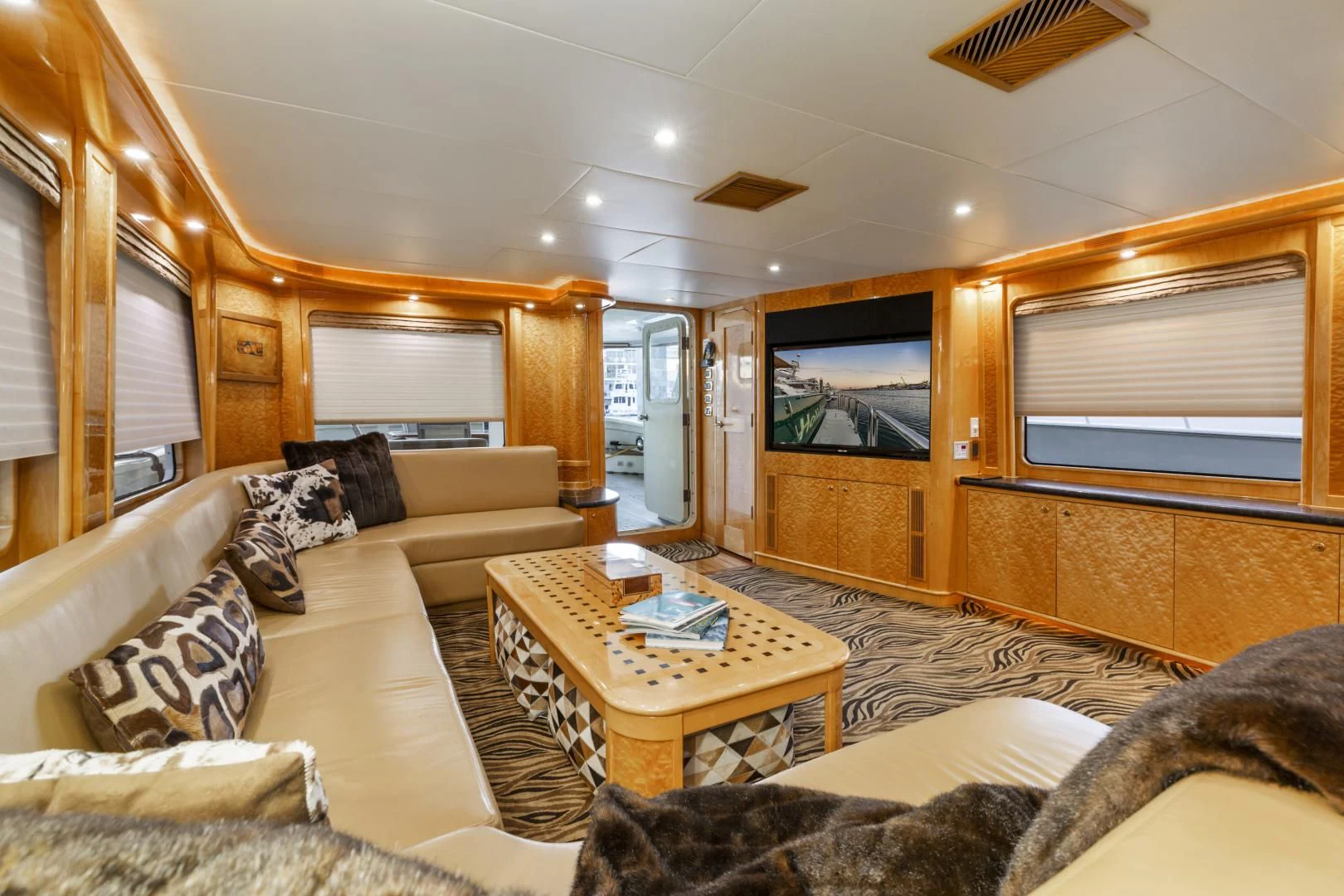 a living room with a large window aboard HOLIDAY Yacht for Sale