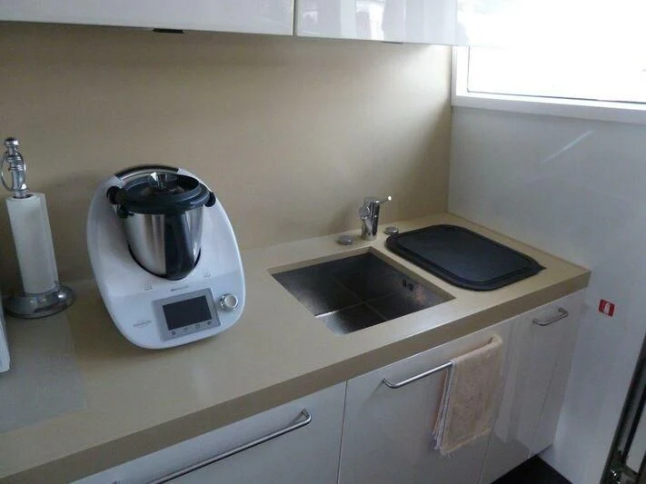 a kitchen with a toaster and a sink aboard TYAMO Yacht for Sale