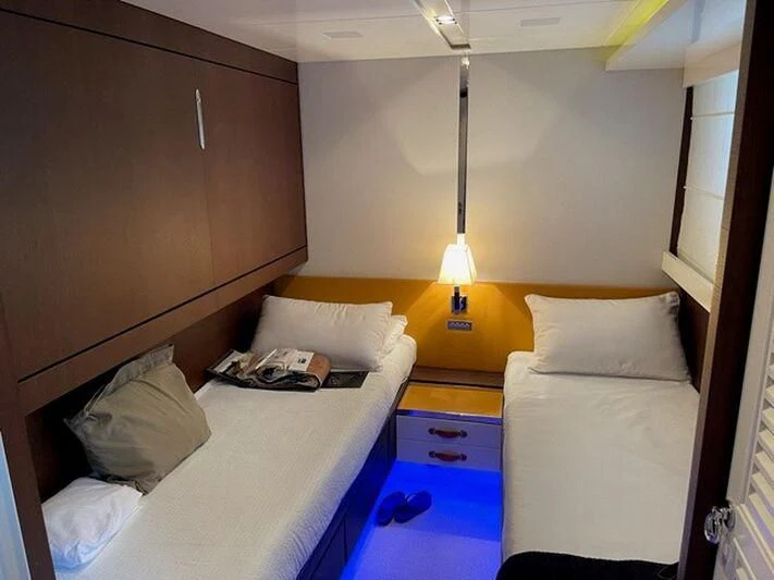 a room with two beds aboard TYAMO Yacht for Sale