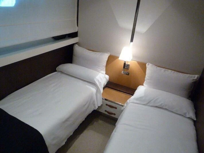 a couple of beds in a room aboard TYAMO Yacht for Sale
