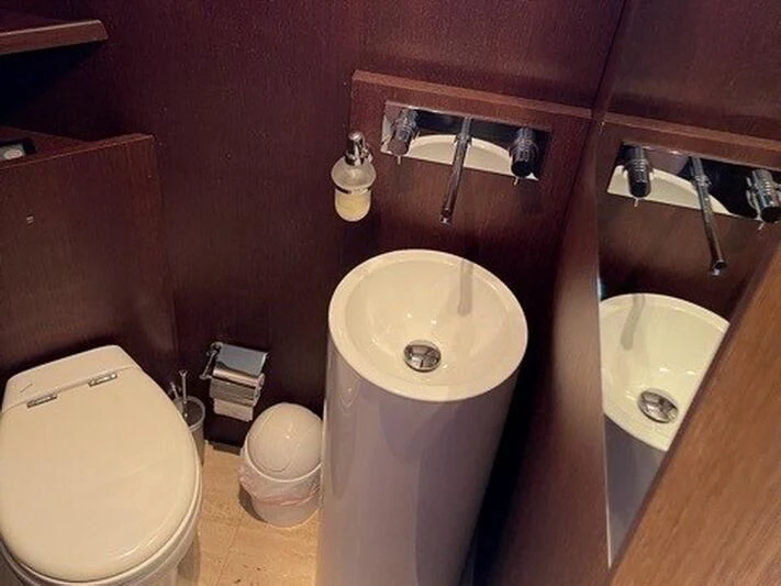 a bathroom with a sink and toilet aboard TYAMO Yacht for Sale