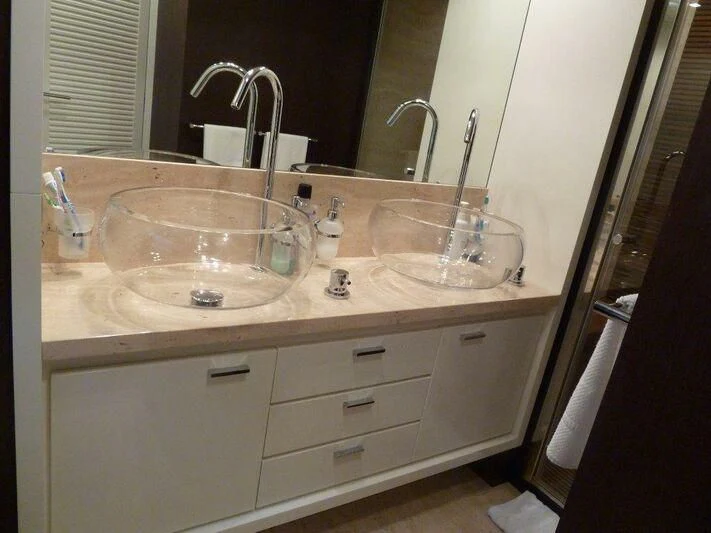 a bathroom with a large mirror aboard TYAMO Yacht for Sale