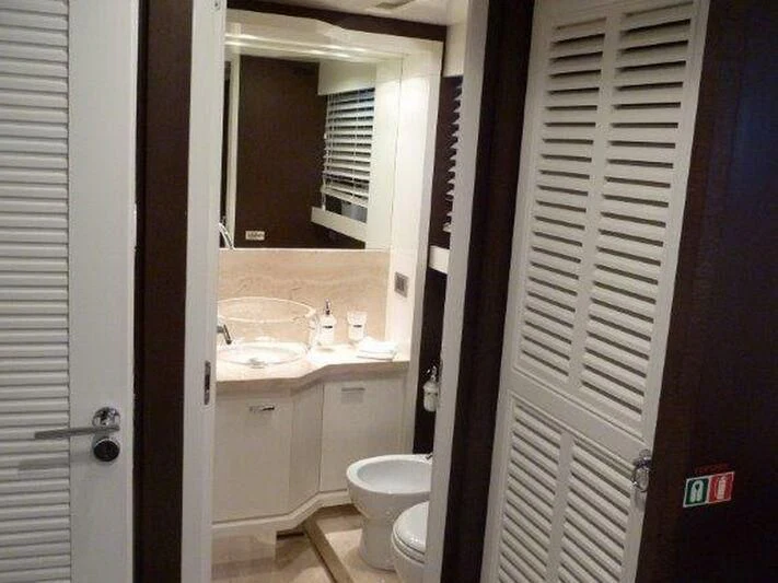 a bathroom with a sink and a toilet aboard TYAMO Yacht for Sale