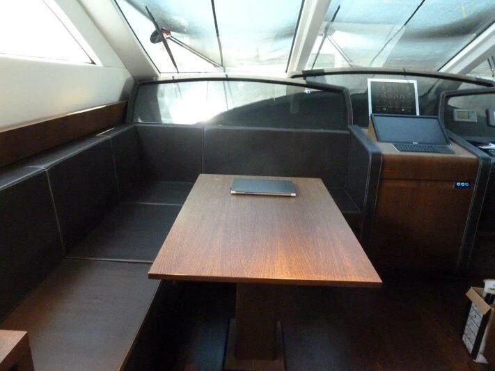 a table in a room aboard TYAMO Yacht for Sale
