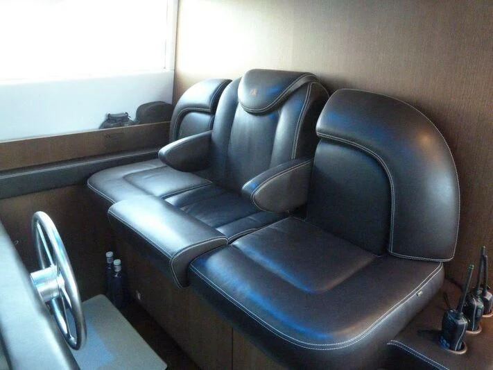a chair in a room aboard TYAMO Yacht for Sale