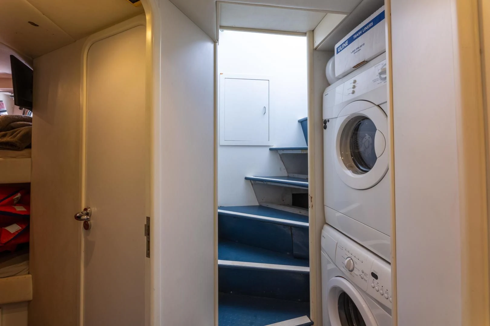 a room with a washer and dryer aboard GRAVITY Yacht for Sale