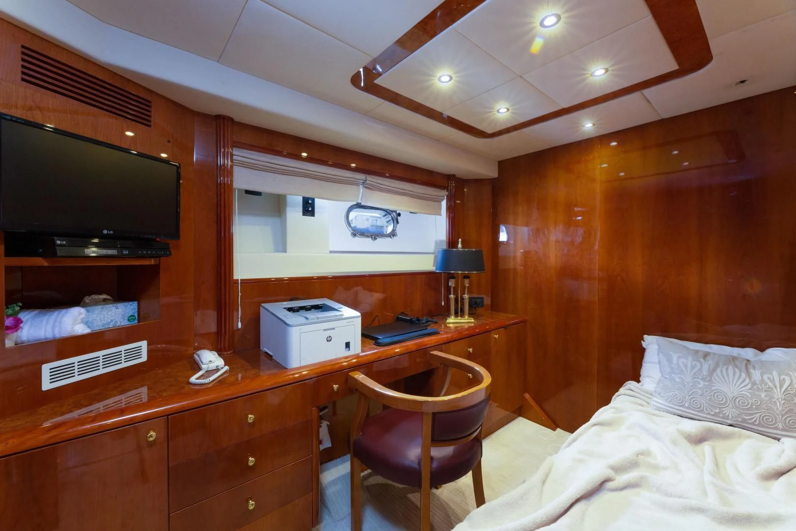 a bedroom with a bed and a television aboard GRAVITY Yacht for Sale