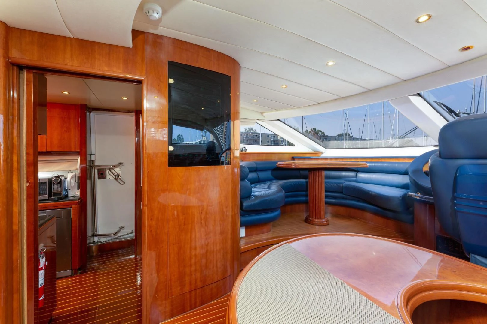 a room with a table and chairs aboard GRAVITY Yacht for Sale