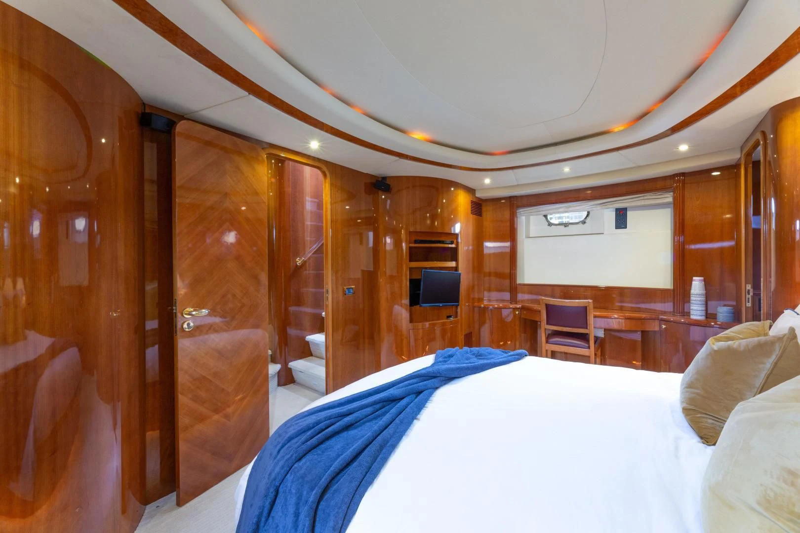 a room with a bed and a television aboard GRAVITY Yacht for Sale
