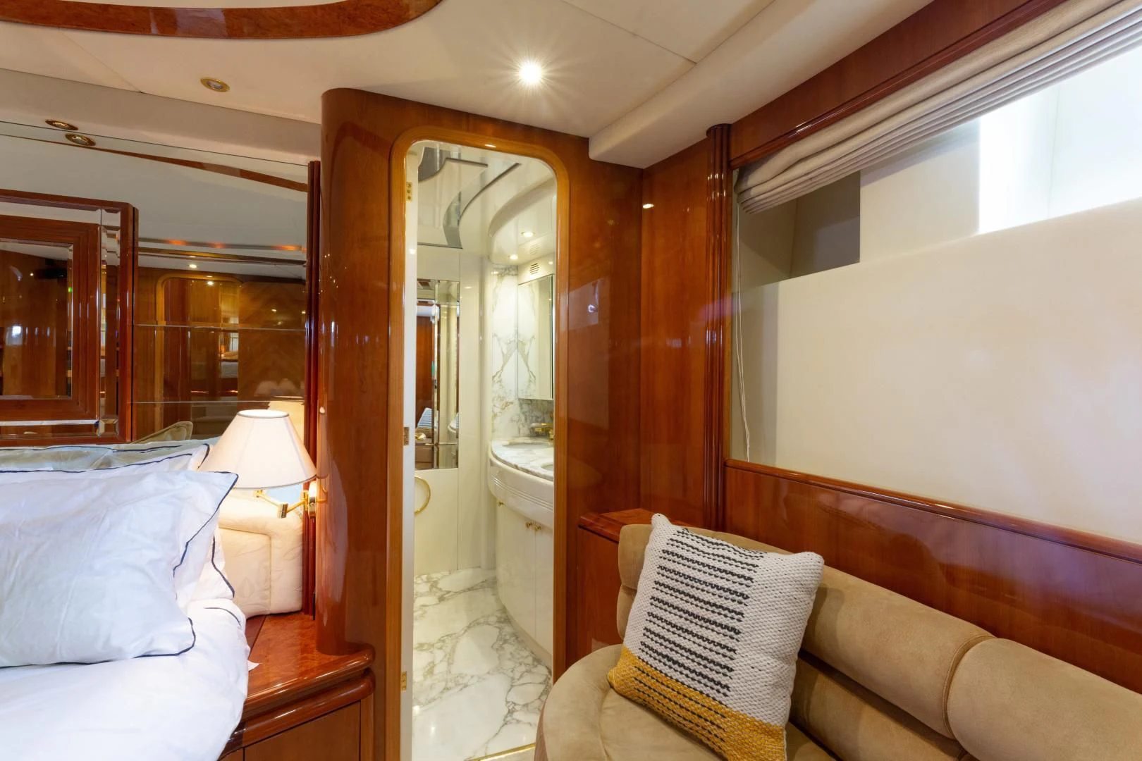 a room with a bed and a mirror aboard GRAVITY Yacht for Sale