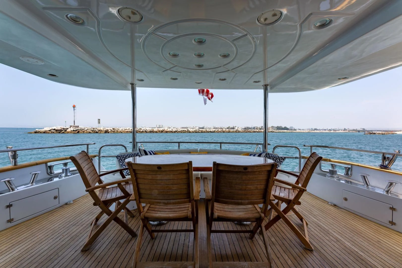 a table and chairs on a deck aboard GRAVITY Yacht for Sale