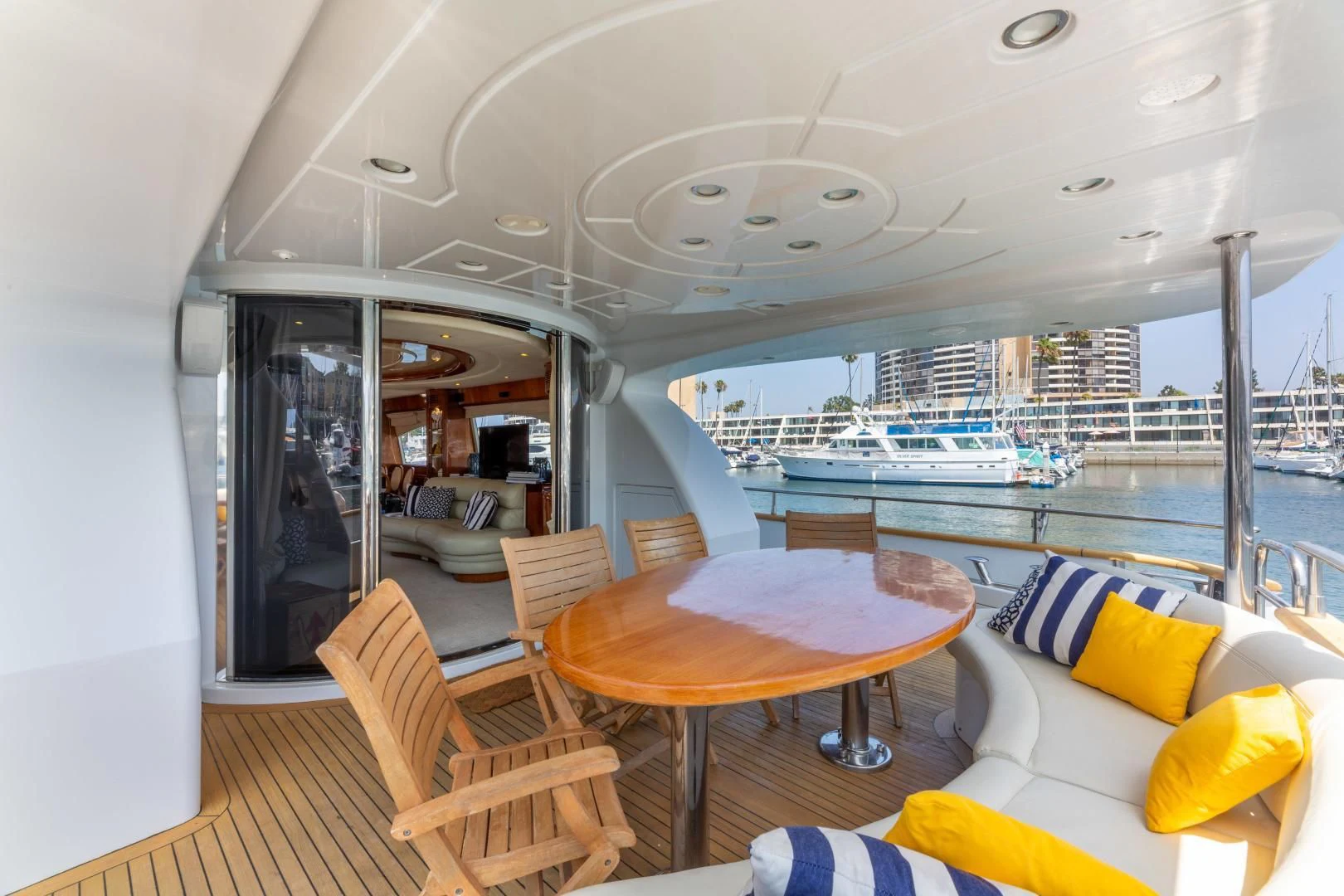 a living room with a table and chairs aboard GRAVITY Yacht for Sale