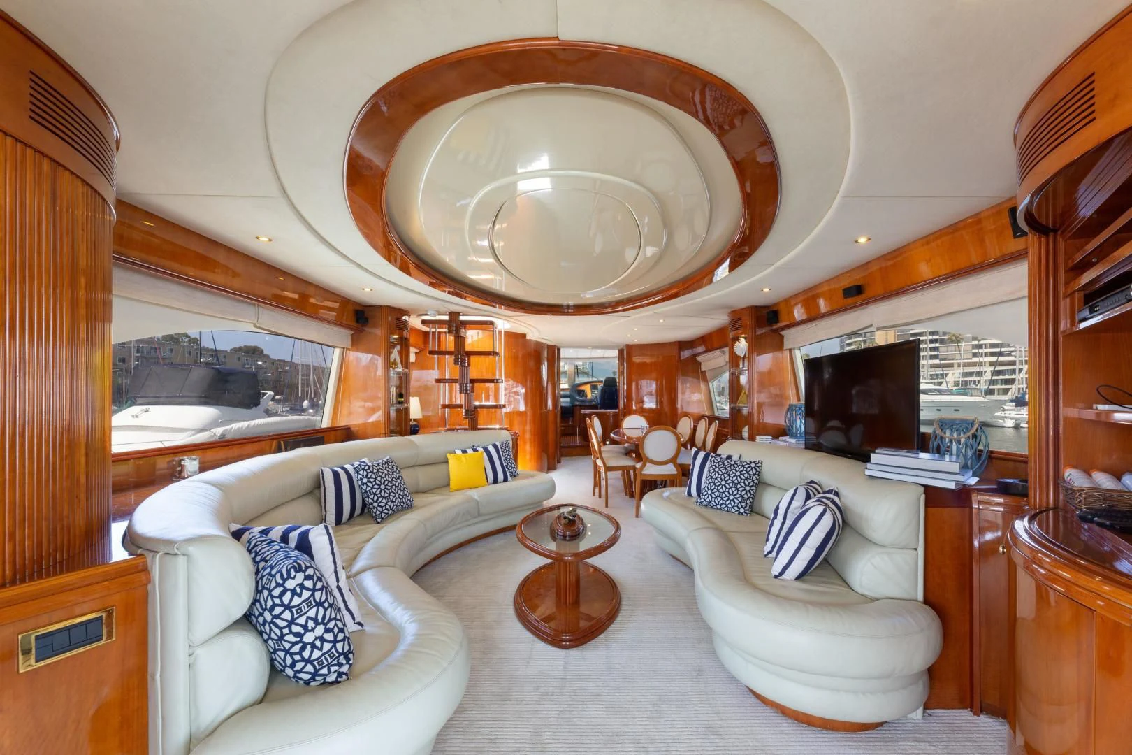 a large living room with a large chandelier aboard GRAVITY Yacht for Sale