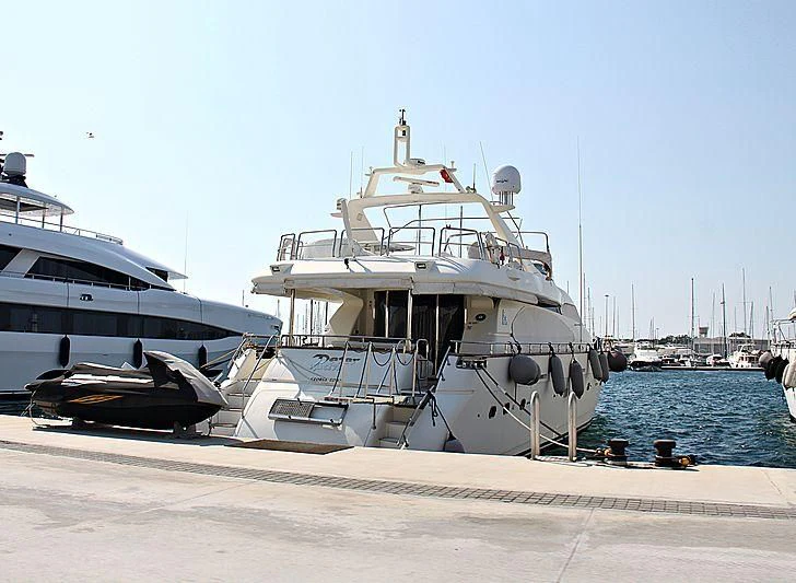 a boat docked at a pier aboard GRAVITY Yacht for Sale