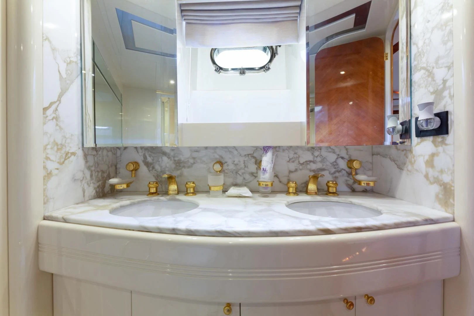 a bathroom with a large mirror aboard GRAVITY Yacht for Sale