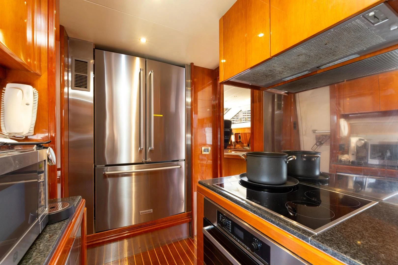 a kitchen with stainless steel appliances aboard GRAVITY Yacht for Sale
