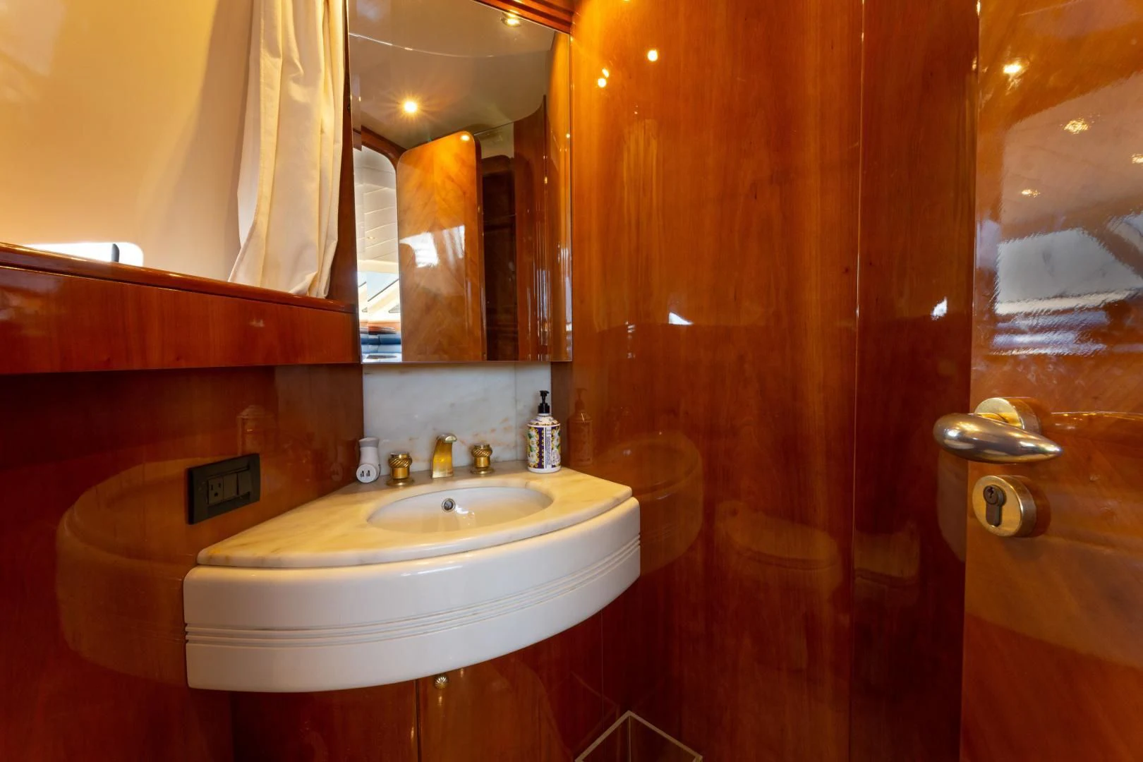 a bathroom with a sink and a mirror aboard GRAVITY Yacht for Sale