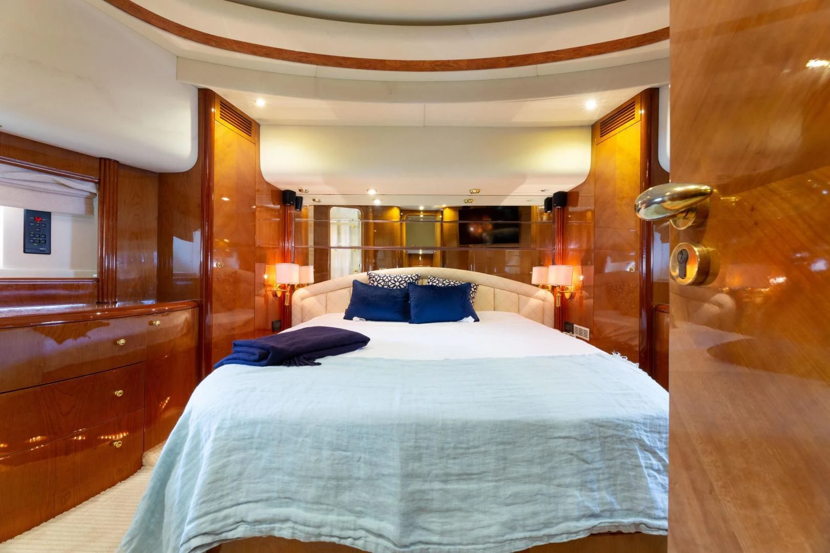 a bed with a blue pillow aboard GRAVITY Yacht for Sale