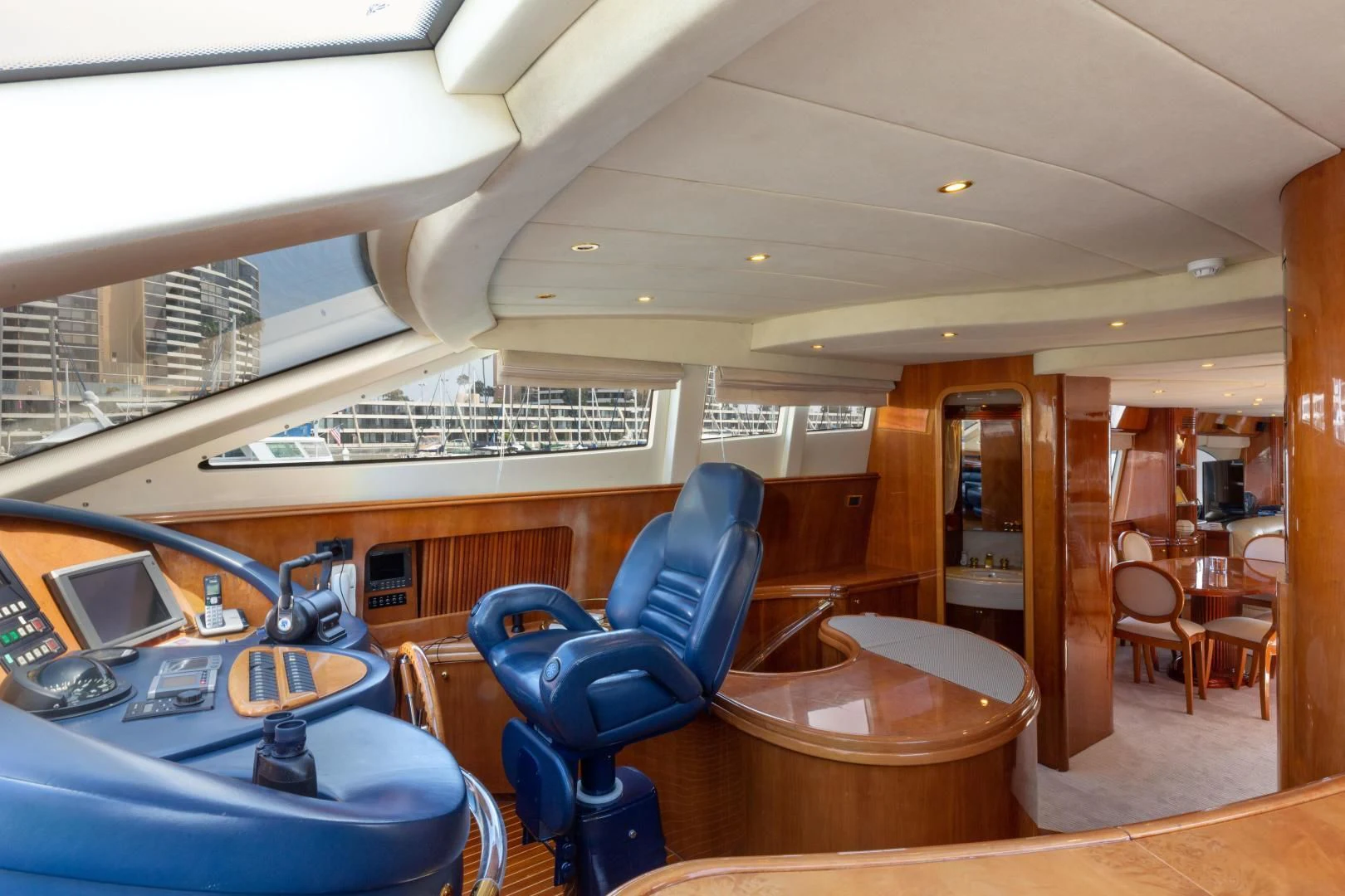 a room with a table chairs and a laptop aboard GRAVITY Yacht for Sale