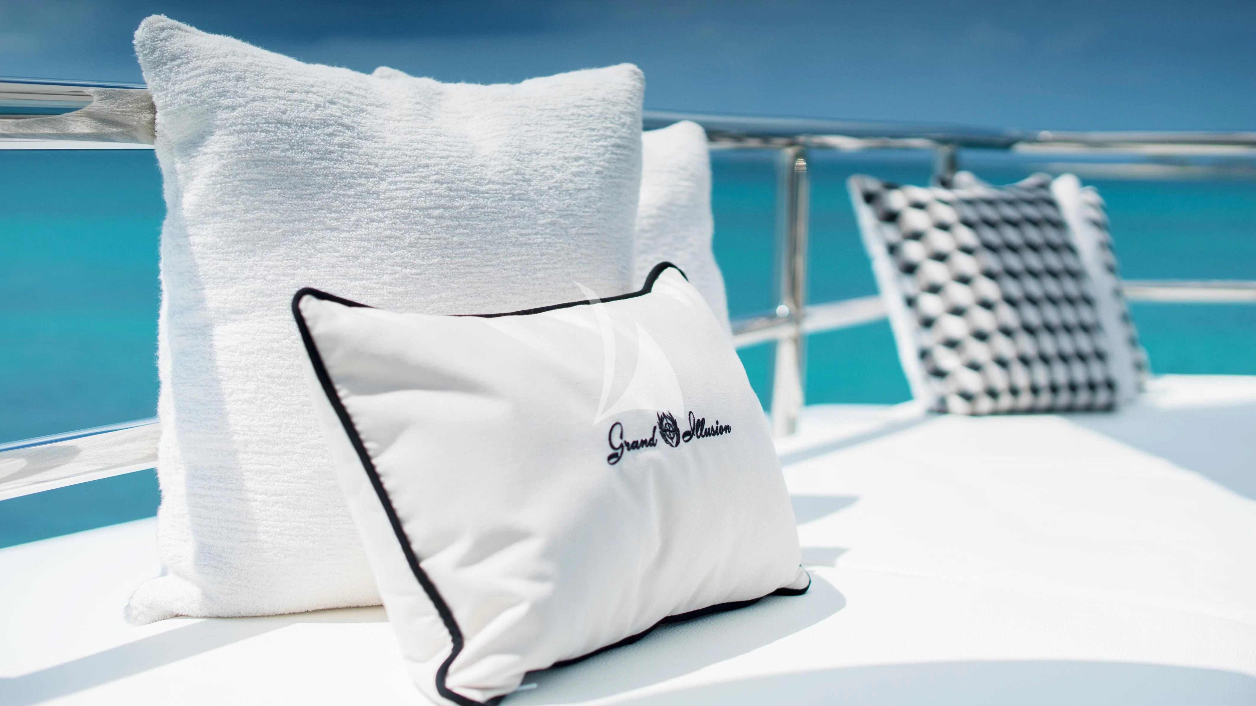 a white towel on a chair aboard GRAND ILLUSION Yacht for Sale