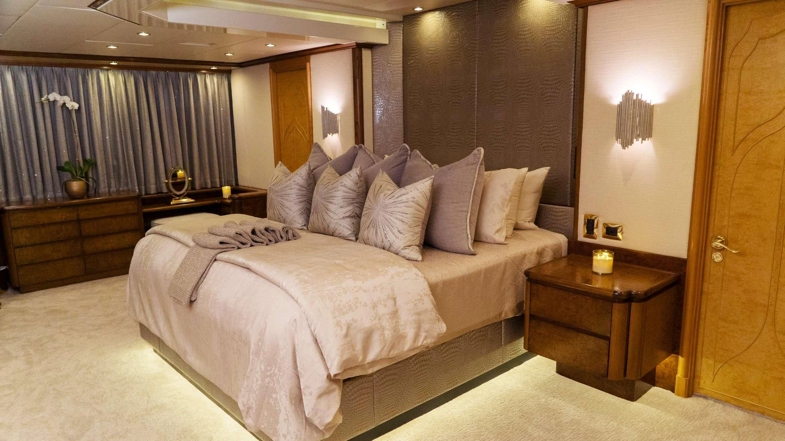 a bed with white sheets aboard GRAND ILLUSION Yacht for Sale