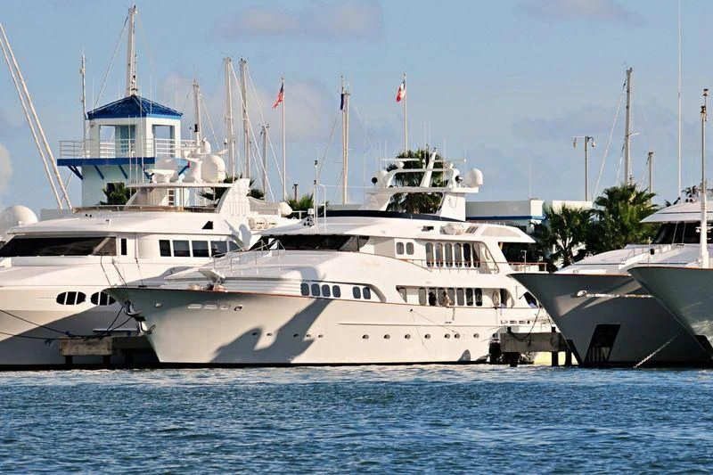 a large white boat in the water aboard GRAND ILLUSION Yacht for Sale