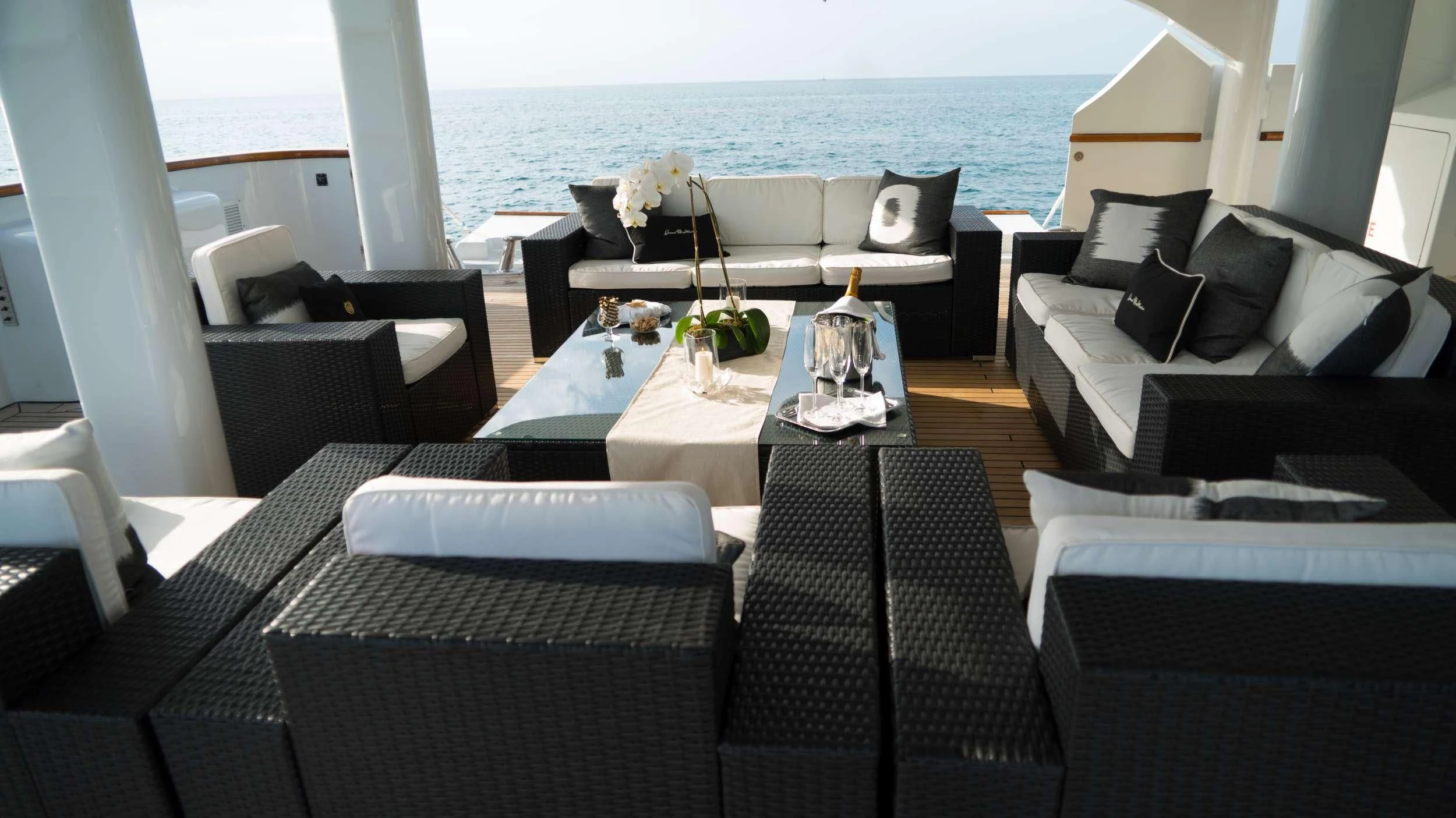a room with a table and chairs aboard GRAND ILLUSION Yacht for Sale