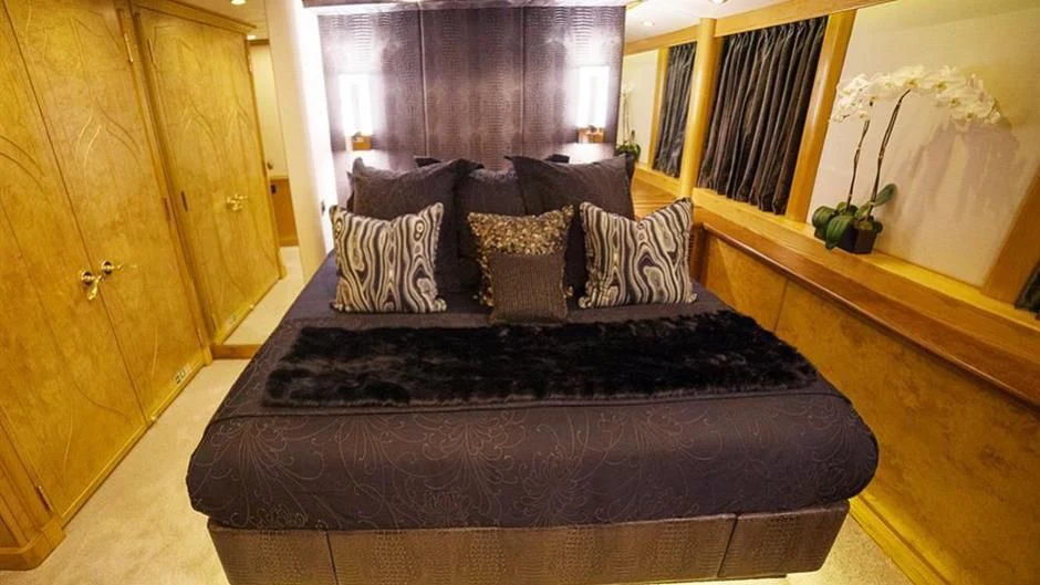 a bed in a room aboard GRAND ILLUSION Yacht for Sale