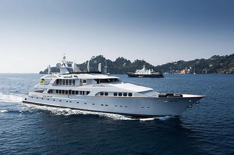 a large white boat on the water aboard GRAND ILLUSION Yacht for Sale