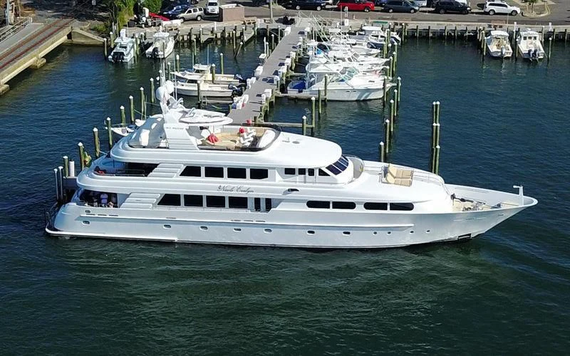 a boat docked at a pier aboard CHARLOTTE ANN Yacht for Sale