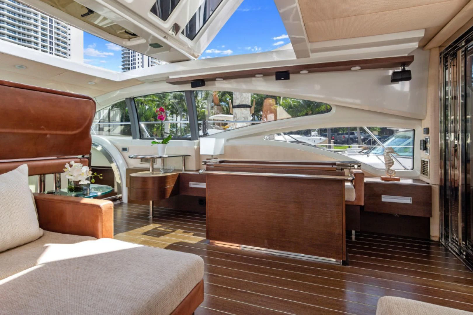 inside of a building with a glass ceiling and a table with chairs aboard BLIND SQUIRREL Yacht for Sale