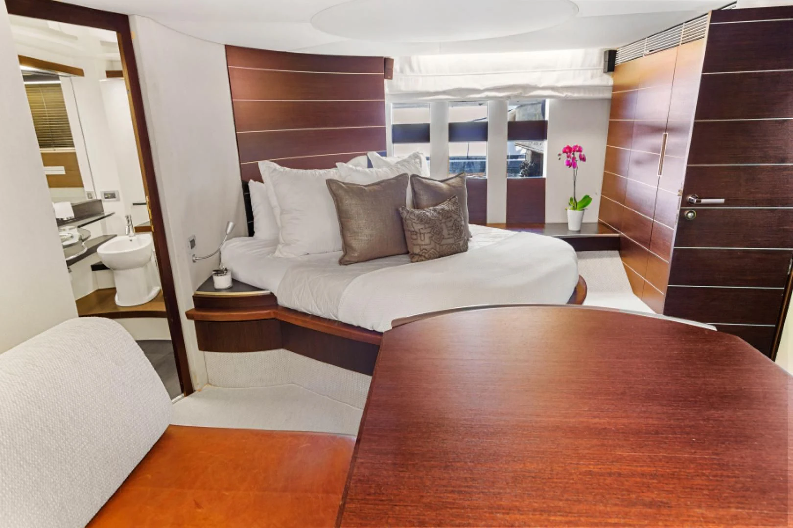 a room with a bed and a table aboard BLIND SQUIRREL Yacht for Sale