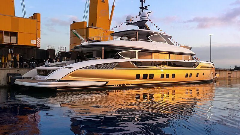 a large white boat in a harbor aboard STEFANIA Yacht for Sale