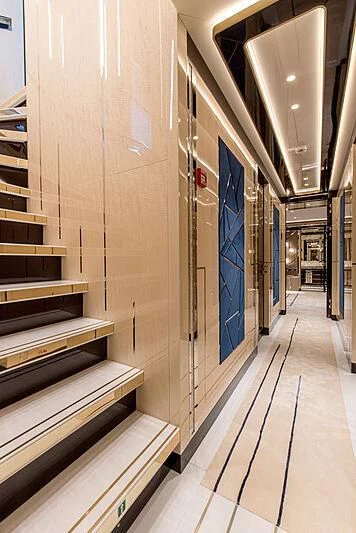 a hallway with a blue door aboard STEFANIA Yacht for Sale