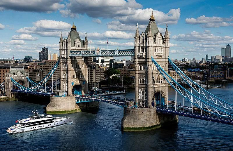 a bridge over water with a boat and a boat in front of it aboard STEFANIA Yacht for Sale