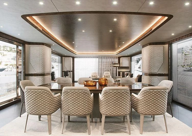a large dining room with a large table and chairs aboard STEFANIA Yacht for Sale
