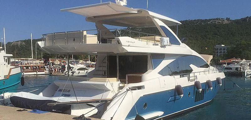 a boat docked at a pier aboard BELLA TWO Yacht for Sale