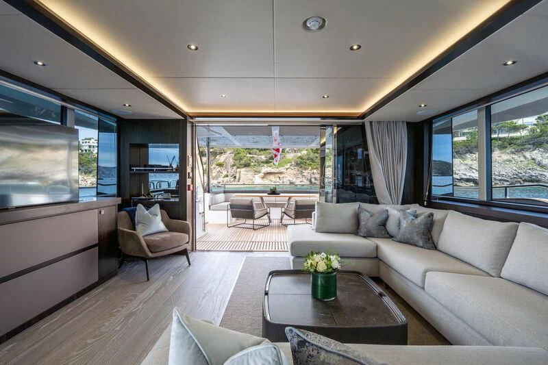a living room with a large window aboard BLUE INFINITY ONE Yacht for Sale