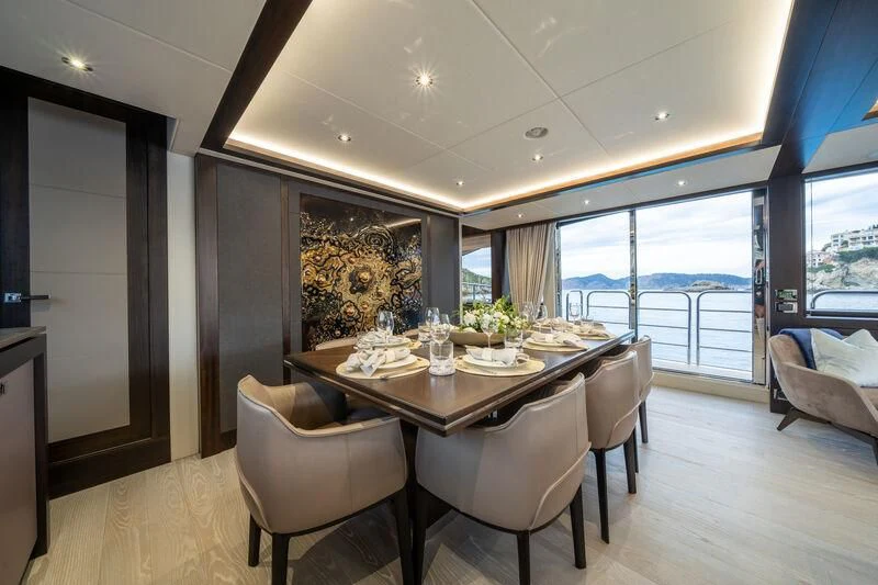 a dining table in a room aboard BLUE INFINITY ONE Yacht for Sale