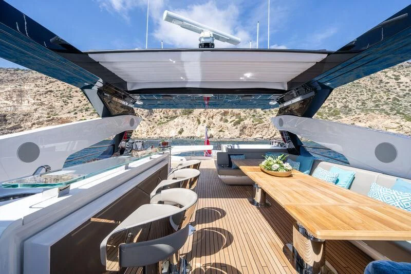 a deck with a deck and chairs on it aboard BLUE INFINITY ONE Yacht for Sale