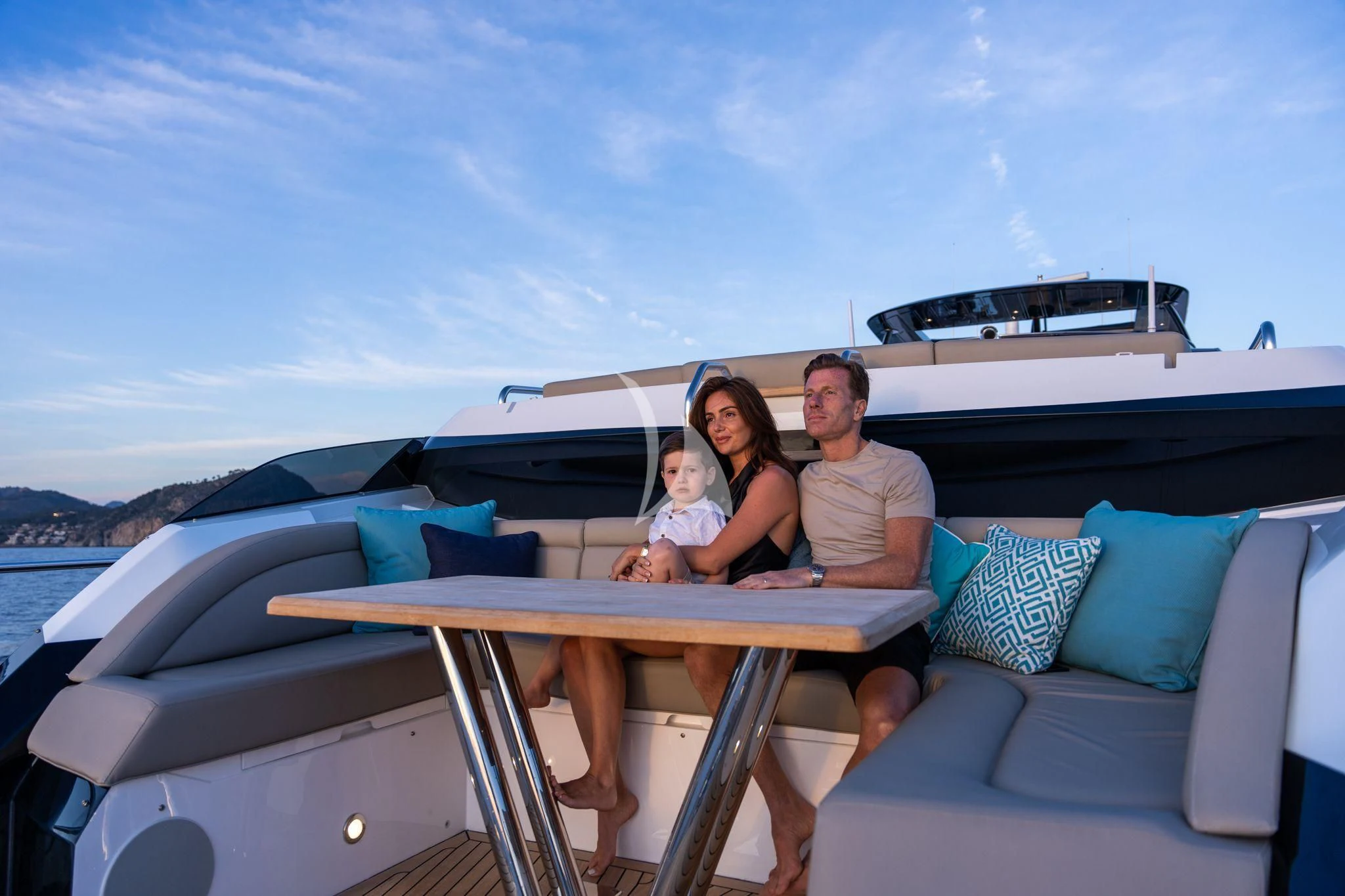 a family sitting on a boat aboard BLUE INFINITY ONE Yacht for Sale